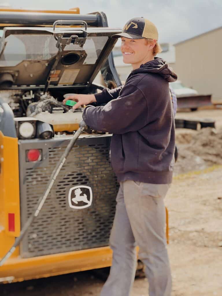 working on a skid steer