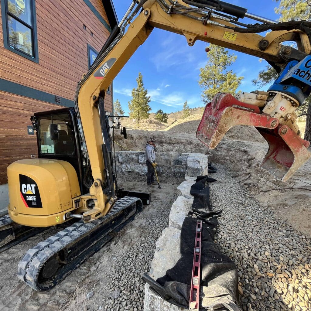 cat 350 building a rock retaining wall